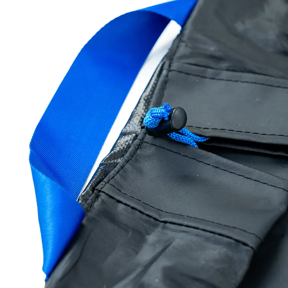 Close-up of a changing mat with blue zipper and cord, on a white background