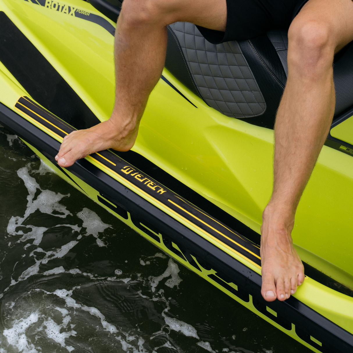 Feet on jet ski gunnel with traction
