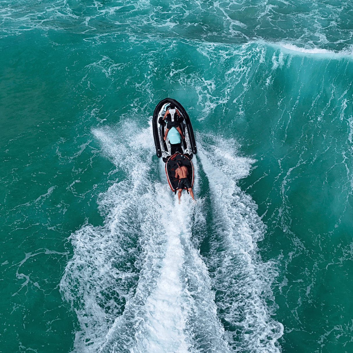 Guy getting rescued on a jet ski sled