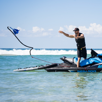 man throwing anchor from jet ski