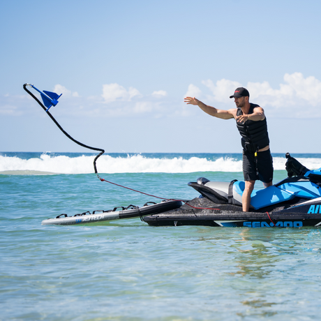 man throwing anchor from jet ski