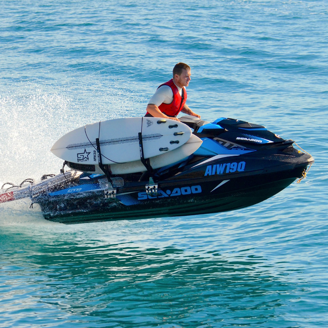 jet ski in air with surfboard rack