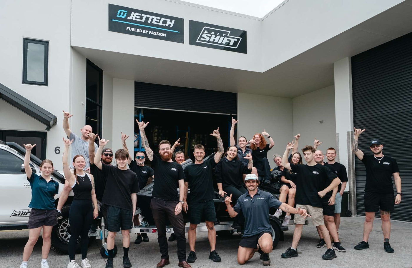 Group of people in front of jet tech and salt shift