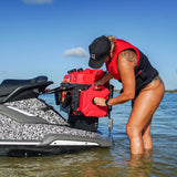 girl filling up a jet ski with fuel