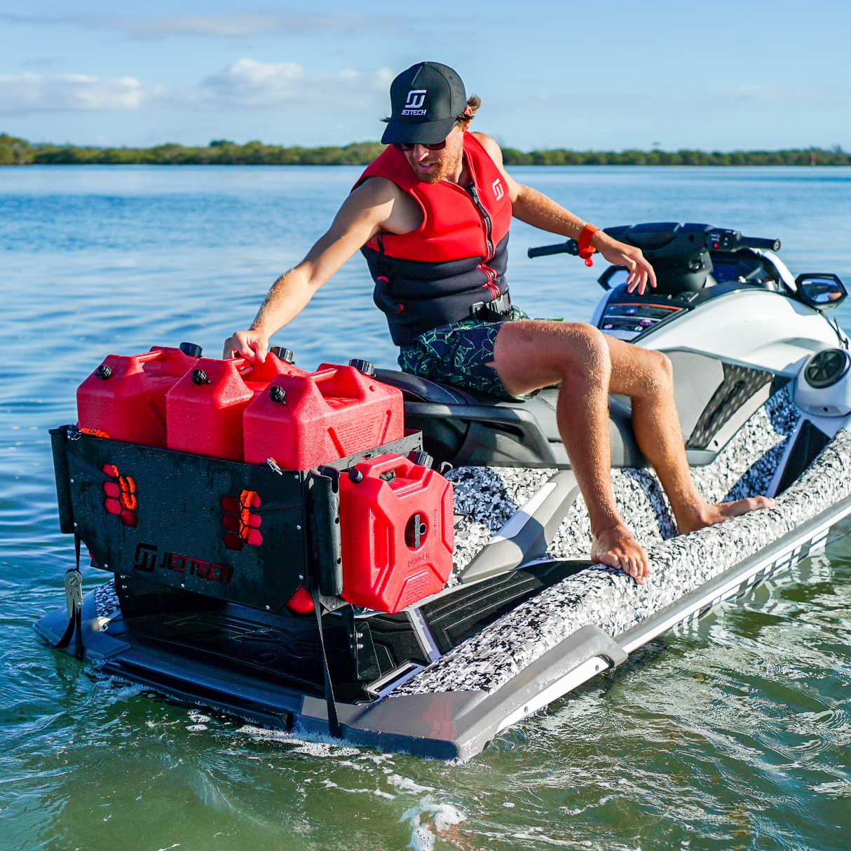 person carrying fuel on a jet ski