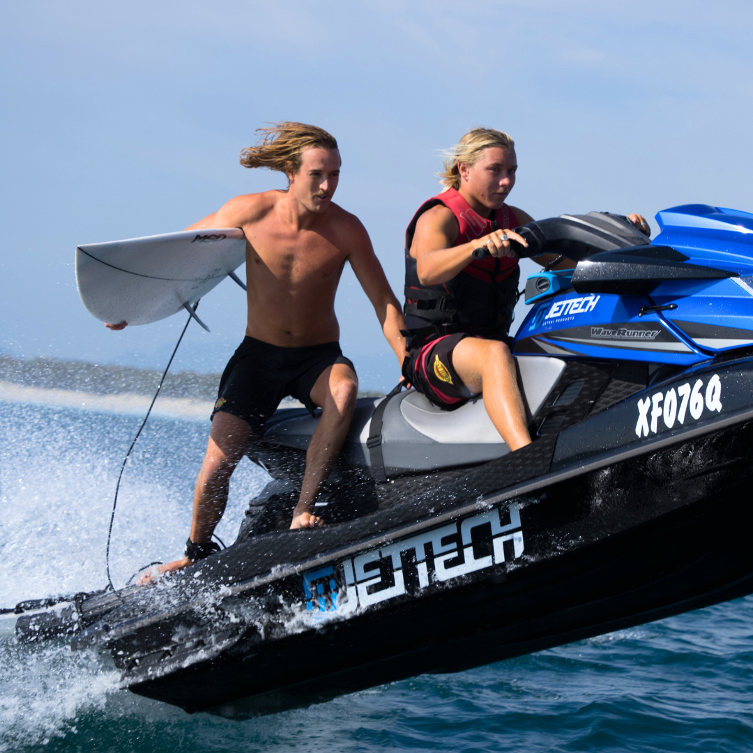 two men on jet ski in air 